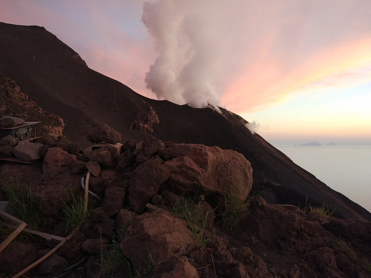 The crater terrace of the Stromboli volcano at sunset with the sea beyond, Aeolian Islands, Italy