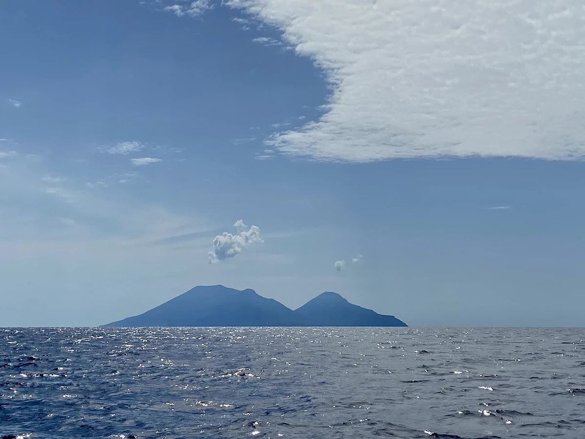 Clear Mediterranean water over volcanic rock on the Aeolian Islands crossing, Italy