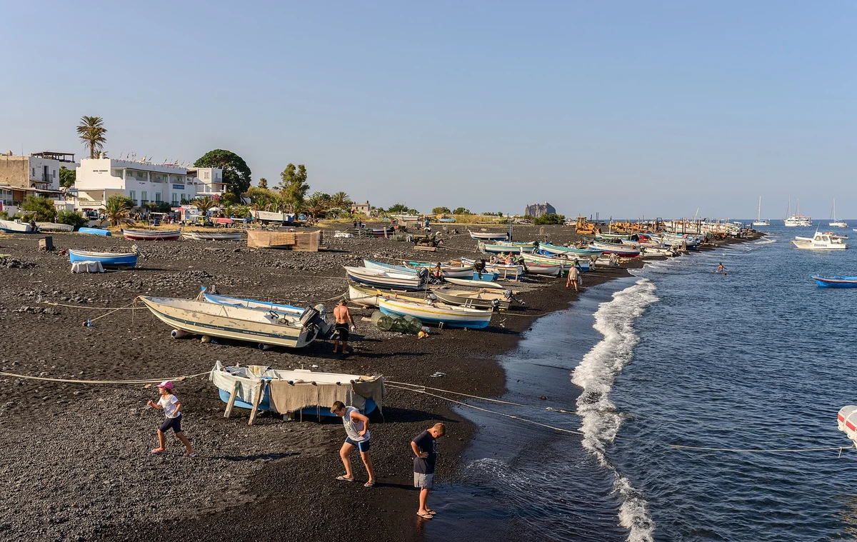 The island of Stromboli seen from the sea with the volcano cone rising above, Aeolian Islands, Italy