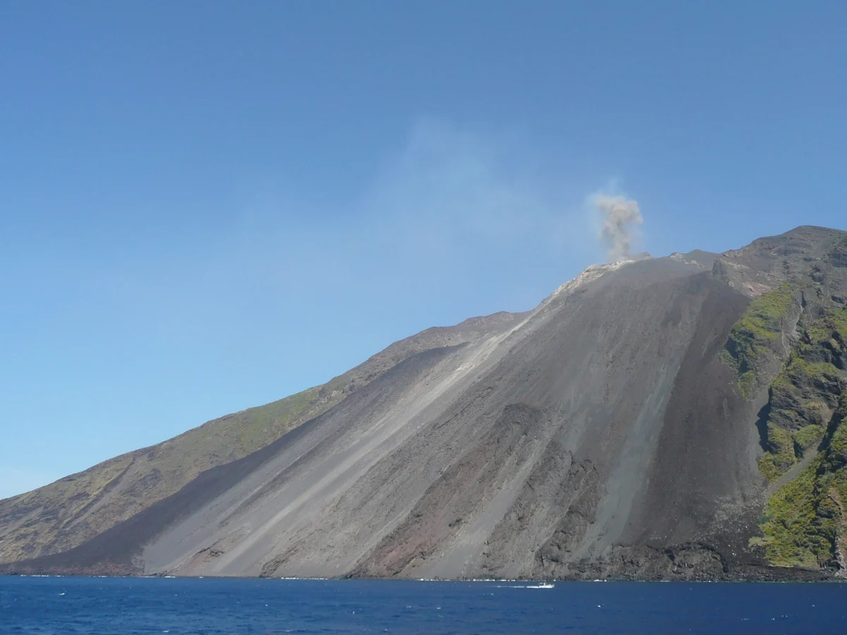 Stromboli island in early summer green under a clear sky, Aeolian Islands, Italy