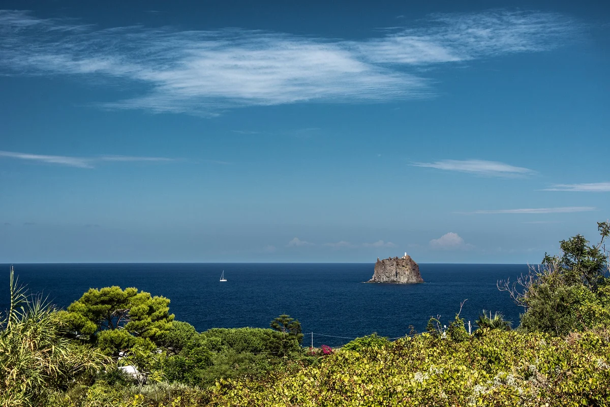 The old volcanic plug of Strombolicchio rising from the sea north-east of Stromboli, Aeolian Islands, Italy