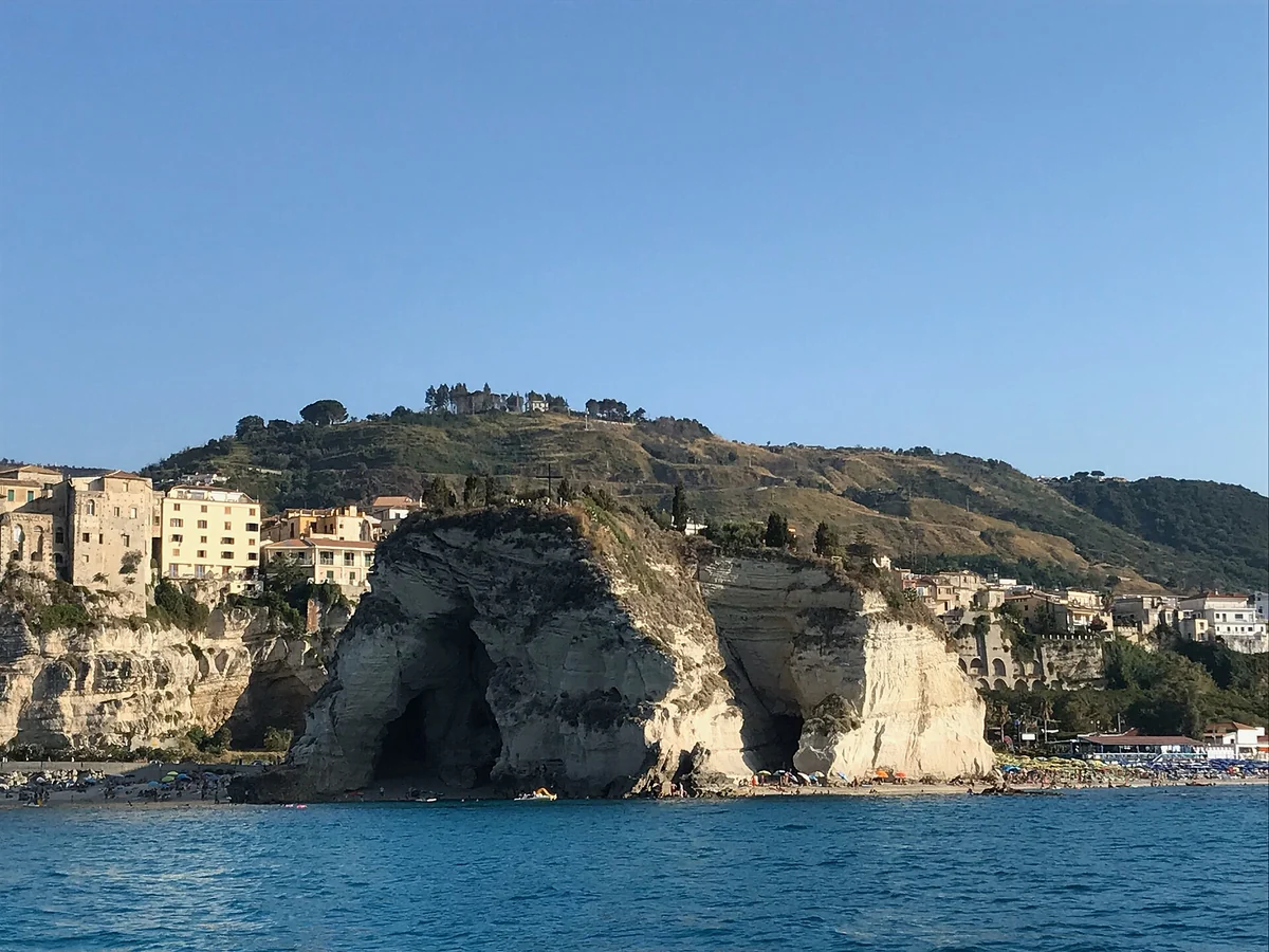 Santa Maria dell'Isola in Tropea seen from the sea, the postcard sight before the Stromboli night cruise sails, Calabria, Italy